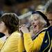 A Michigan fan smiles in the second half of the game against Binghamton on Tuesday. Daniel Brenner I AnnArbor.com